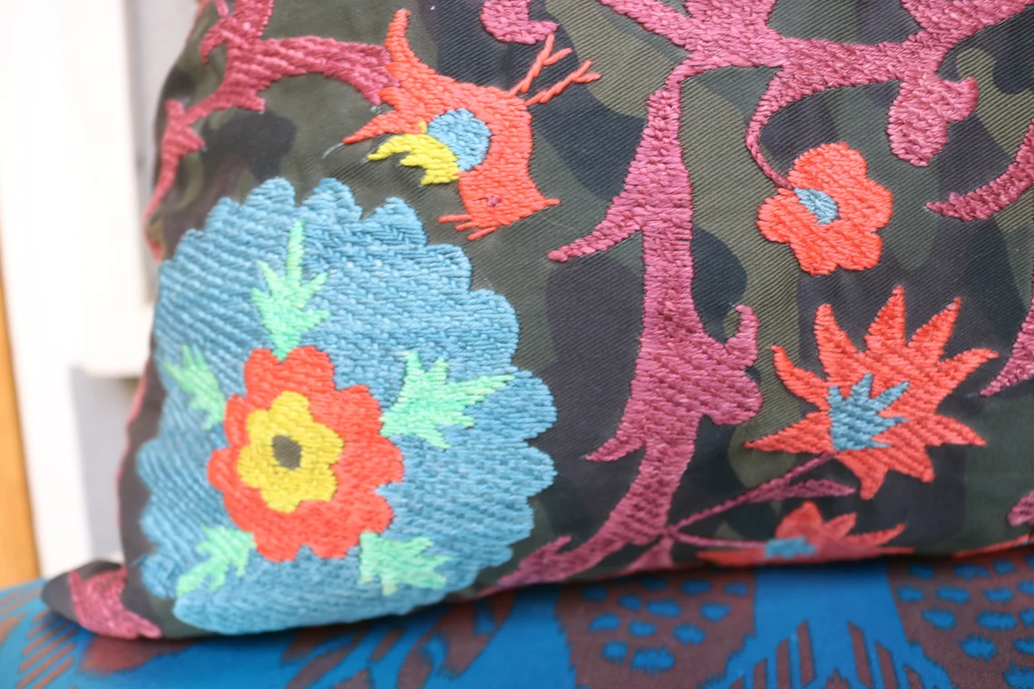 Suzani pillowcase covers are traditional Uzbek textiles, hand-embroidered with vibrant floral and geometric patterns.